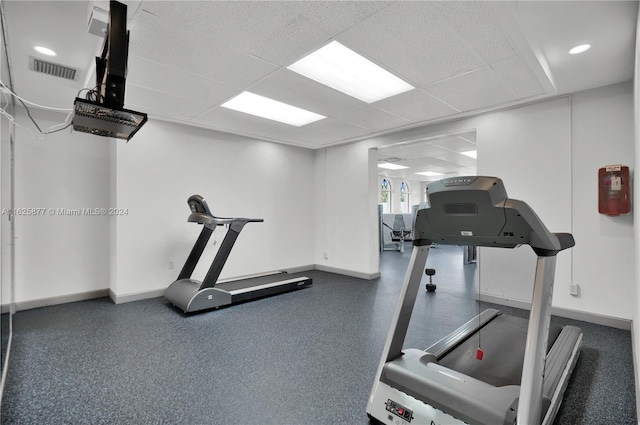 workout area with a drop ceiling