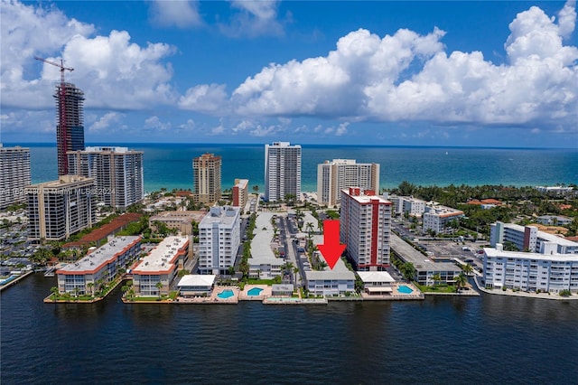 drone / aerial view featuring a water view and a city view