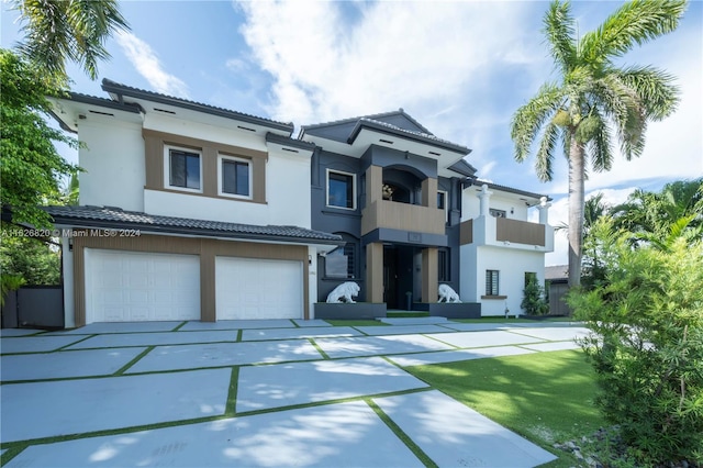 view of front of house featuring a balcony and a garage