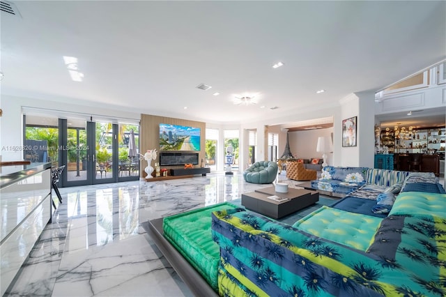 living room with crown molding, french doors, and tile patterned floors