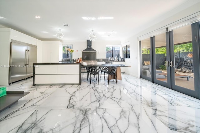 interior space with light tile patterned floors and french doors