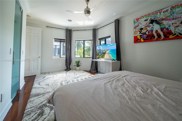 bedroom featuring dark hardwood / wood-style floors and ceiling fan