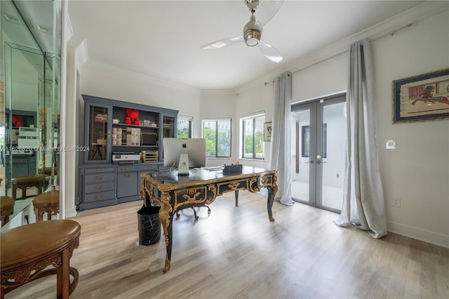 office area with crown molding, french doors, light wood-type flooring, and ceiling fan