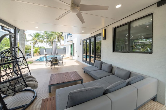 view of patio with outdoor lounge area and ceiling fan