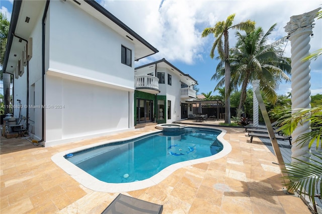 view of swimming pool featuring a patio area