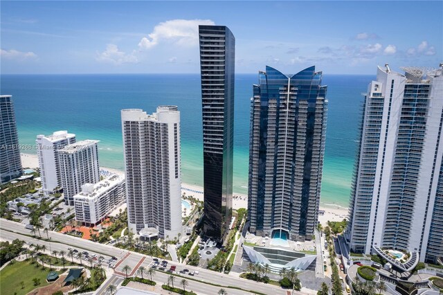 exterior space with a beach view and a water view