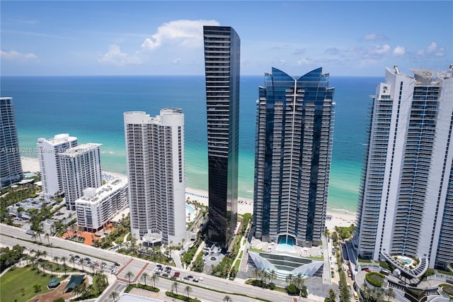 view of city featuring a water view and a beach view