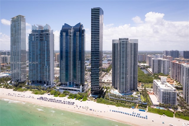 view of city featuring a water view and a view of the beach