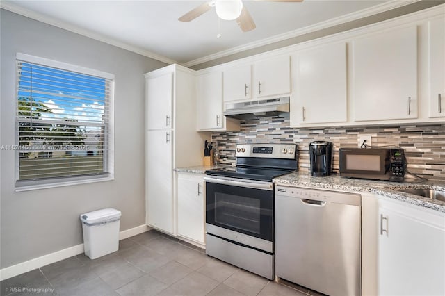 kitchen with stainless steel appliances, white cabinetry, and decorative backsplash