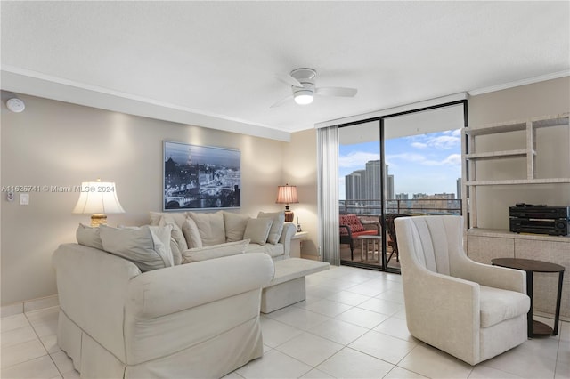 tiled living room featuring ceiling fan, ornamental molding, and floor to ceiling windows