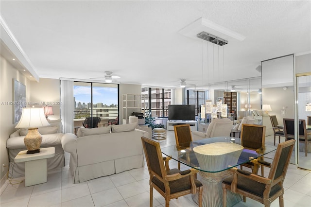 dining room with light tile patterned floors and ceiling fan