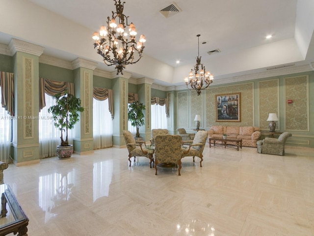 dining room featuring a chandelier and ornate columns