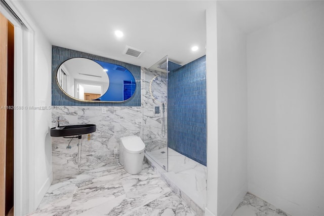 full bath with visible vents, a marble finish shower, a sink, toilet, and marble finish floor