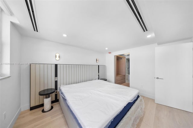 bedroom featuring recessed lighting, light wood-style flooring, visible vents, and baseboards