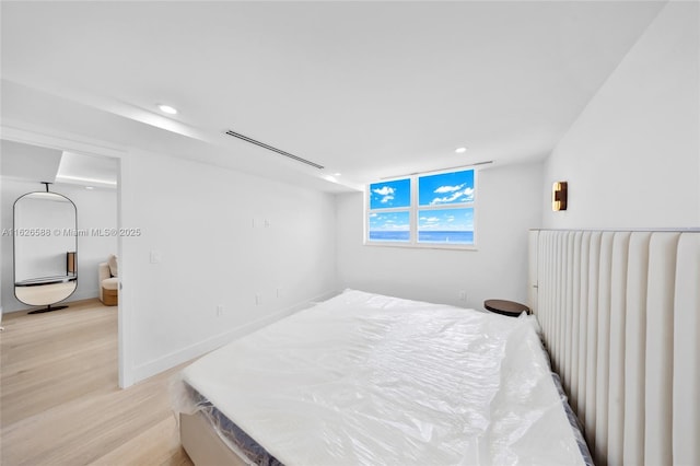 bedroom featuring recessed lighting and light wood finished floors