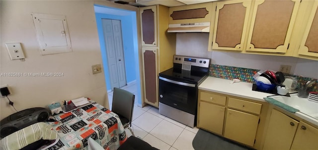 kitchen with light tile patterned floors, stainless steel electric range, and electric panel