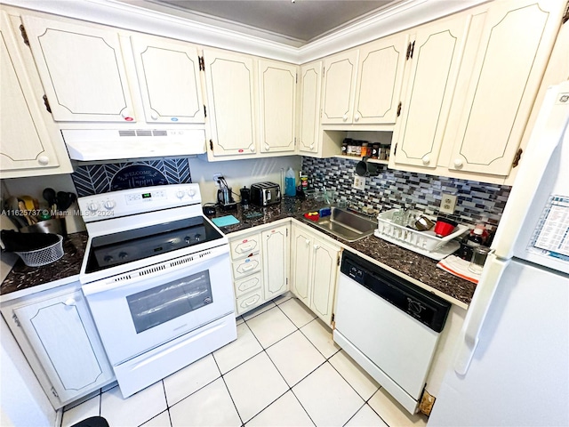 kitchen featuring premium range hood, white appliances, sink, light tile patterned floors, and backsplash