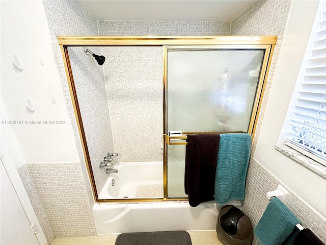 bathroom with tile patterned flooring and enclosed tub / shower combo