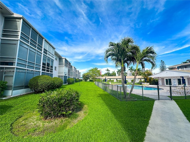 view of yard featuring a fenced in pool