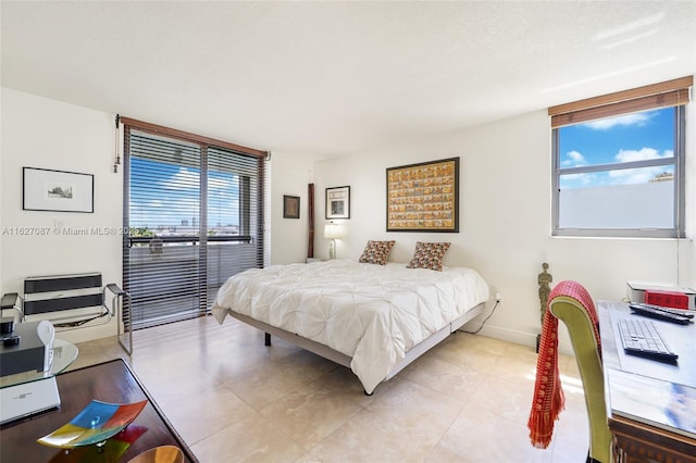 bedroom with light tile patterned floors