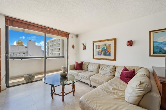 living room featuring tile patterned flooring and a textured ceiling