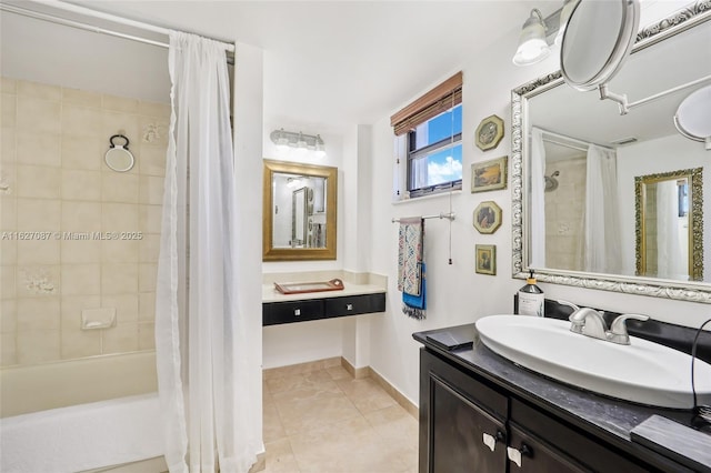full bathroom with vanity, tile patterned floors, baseboards, and shower / tub combo