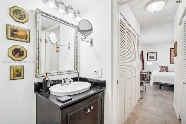 bathroom featuring tile patterned flooring and vanity