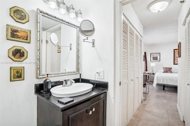 bathroom with vanity and tile patterned flooring