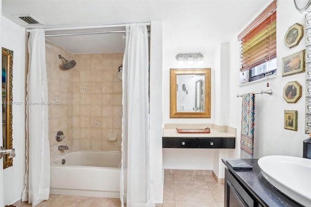 bathroom with vanity, tile patterned flooring, shower / tub combo with curtain, and visible vents