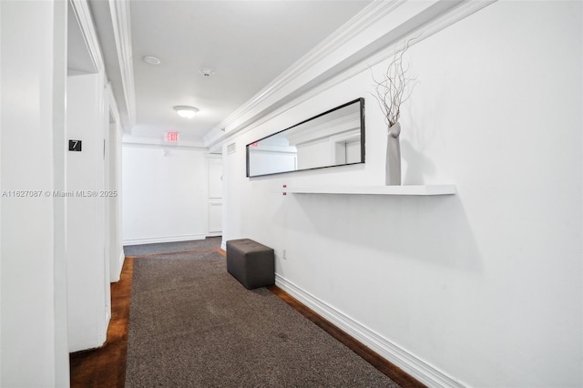 hallway with baseboards and crown molding