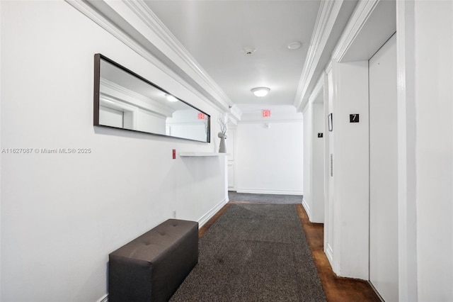 hall with elevator and baseboards