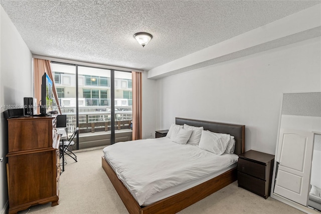 carpeted bedroom with a textured ceiling