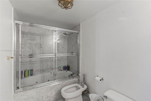 bathroom with a bidet and combined bath / shower with glass door