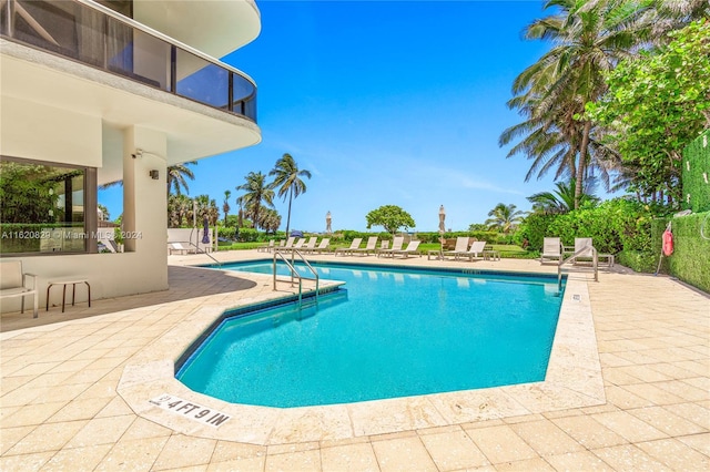 view of swimming pool with a patio