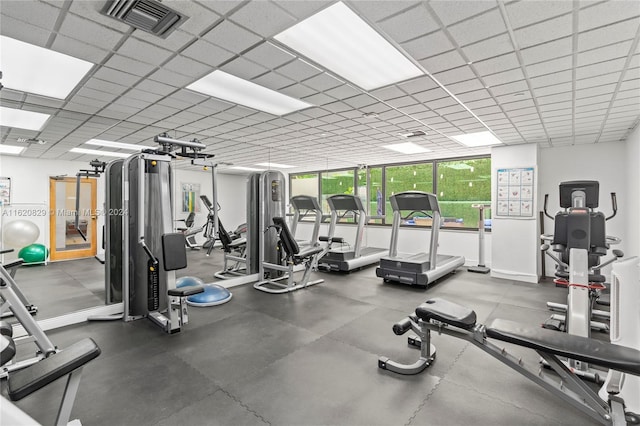 gym featuring a paneled ceiling