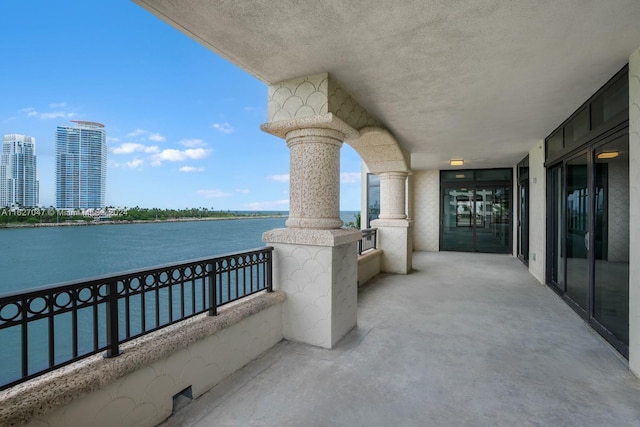 balcony featuring a water view