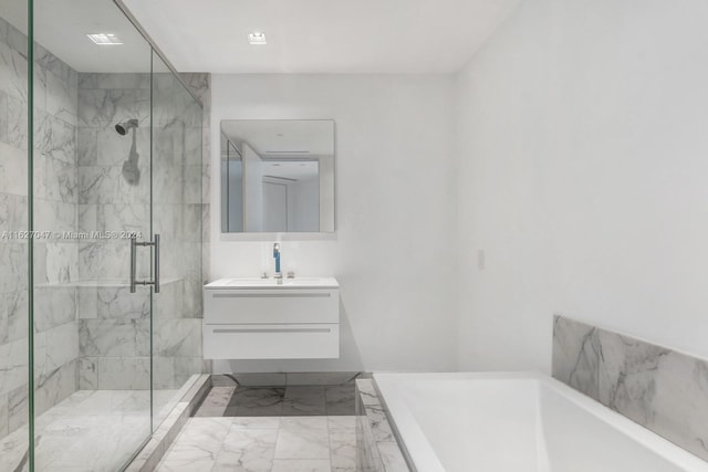 bathroom featuring separate shower and tub and vanity