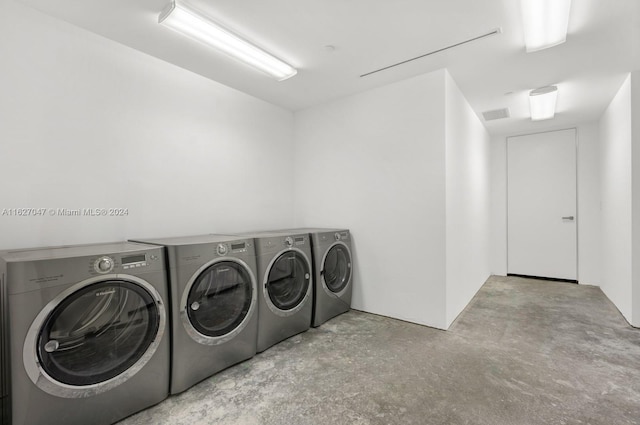 washroom featuring washer and dryer