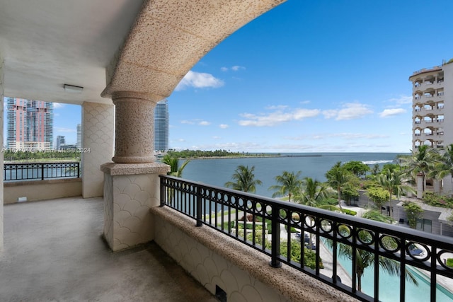 balcony featuring a water view