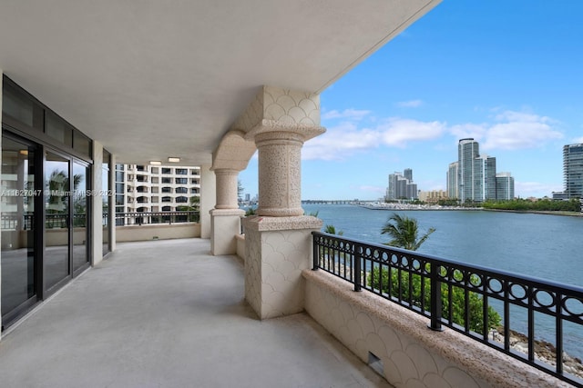 balcony featuring a water view