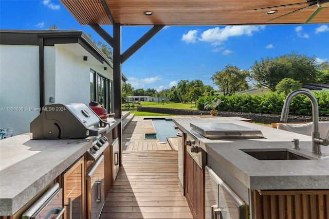 7000 SW 125th St, Pinecrest, FL 33156 - wooden deck featuring area for grilling and a sink