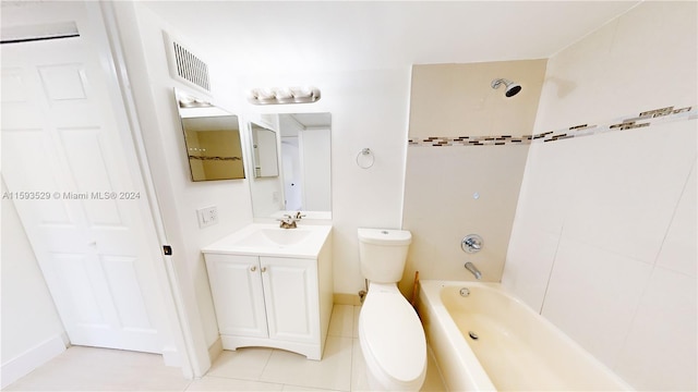 full bathroom featuring vanity, tile patterned flooring, tiled shower / bath, and toilet