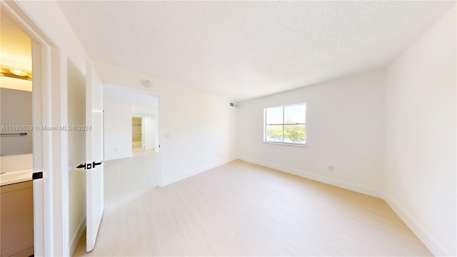 empty room with a textured ceiling