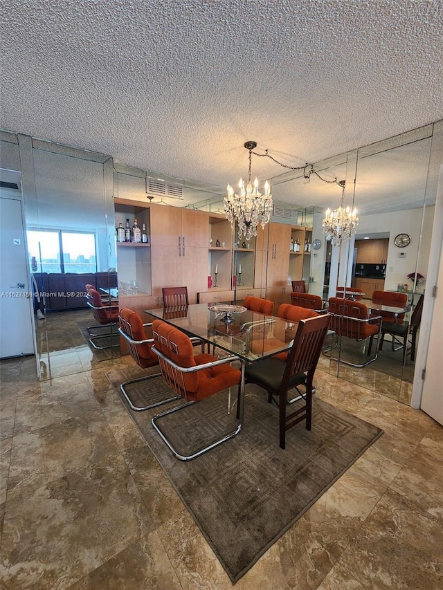 tiled living room with a chandelier and a textured ceiling