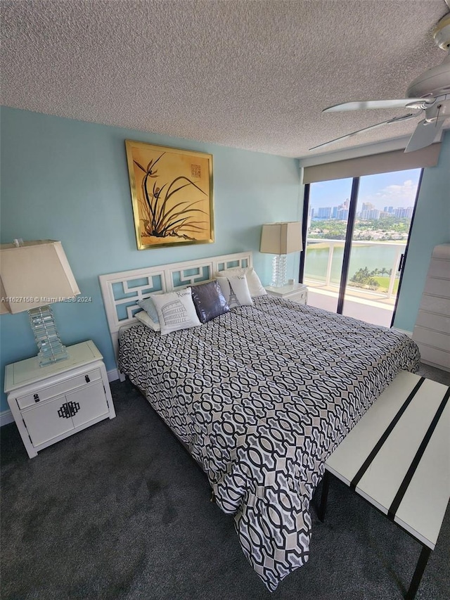 carpeted bedroom featuring a textured ceiling