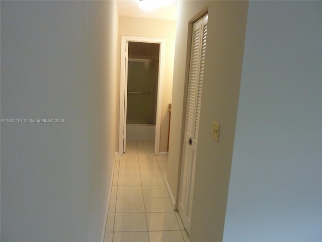 hall featuring light tile patterned floors