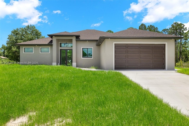 prairie-style house featuring a front lawn