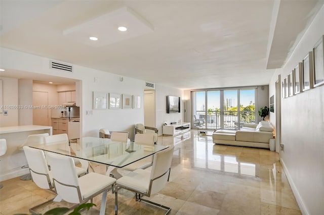 tiled dining area with expansive windows