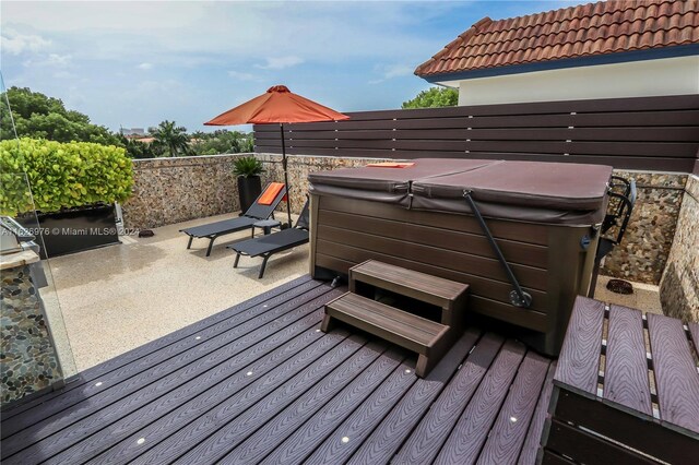 645 NE 9th Ave, Fort Lauderdale, FL 33304 - wooden deck featuring a hot tub and a patio