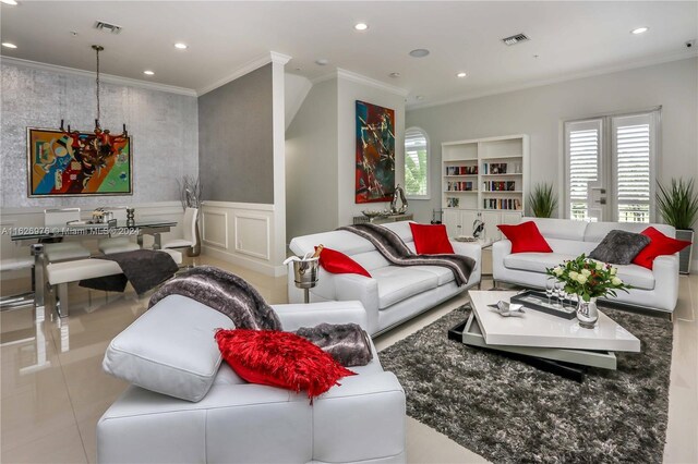 645 NE 9th Ave, Fort Lauderdale, FL 33304 - living area featuring recessed lighting, crown molding, healthy amount of natural light, and wainscoting